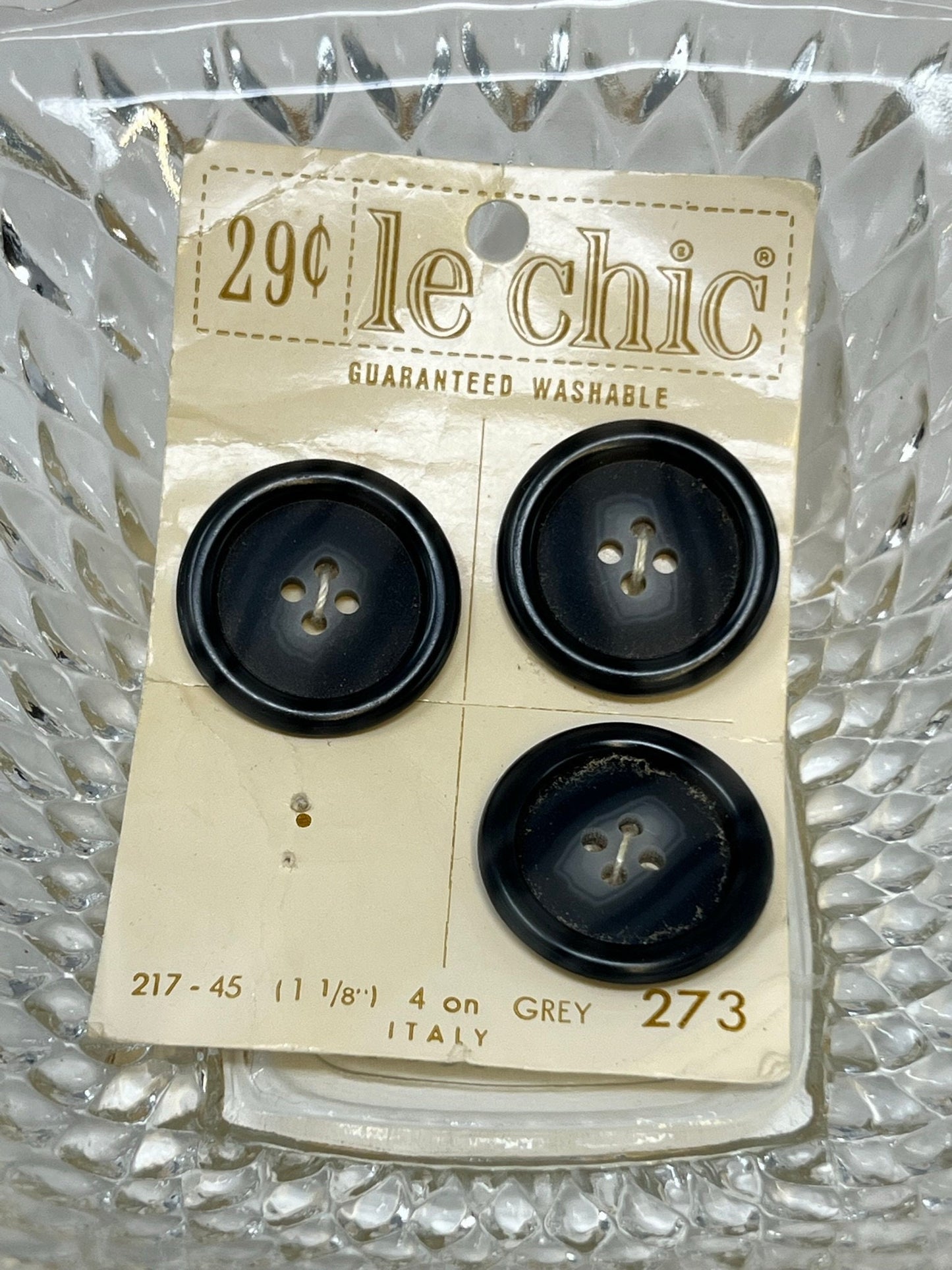 Button Pack #52 - Gray and White Vintage Buttons - 4 Holes - 3 Buttons - Le Chic - 217 size 45 1-1/8" - On card, one missing