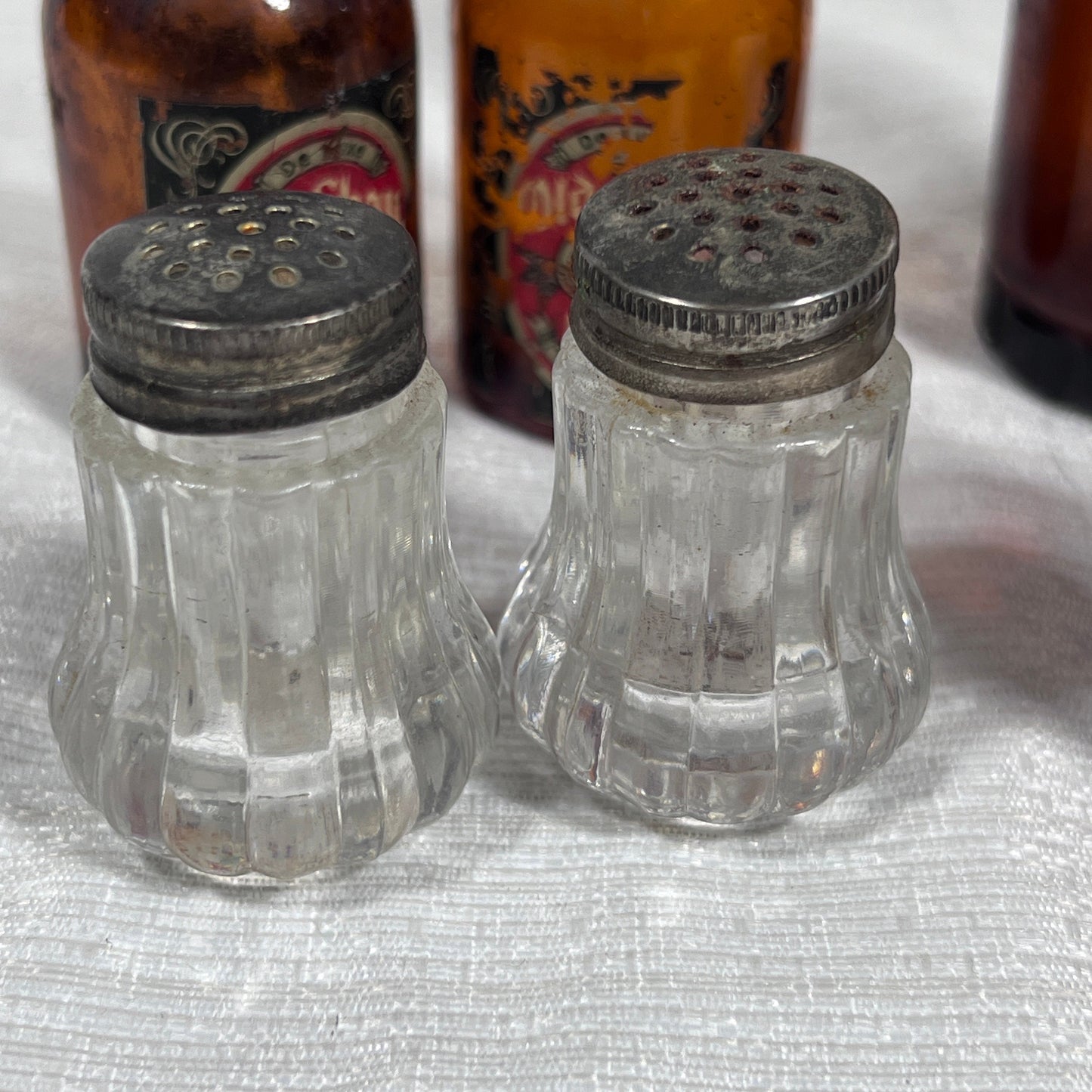 Lot of old Salt and Pepper Shakers and Glass Bottles