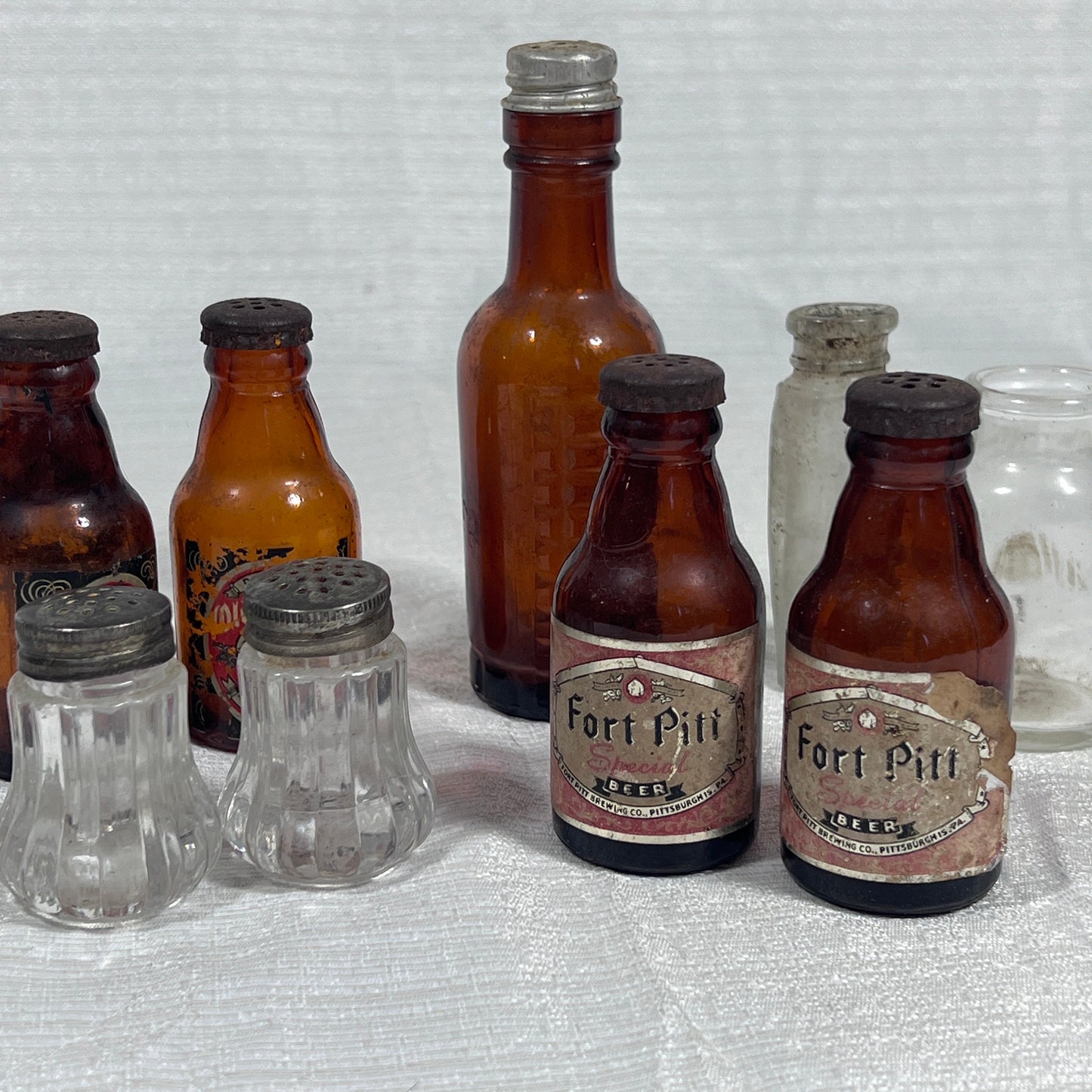 Lot of old Salt and Pepper Shakers and Glass Bottles